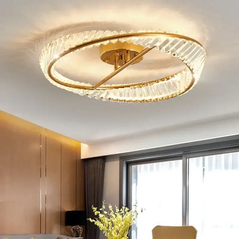Modern gold decorbites crystal led chandelier featuring a circular design with two concentric faceted crystal rings
