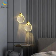 Two golden circular decorbites crystal led pendant lights with sparkling glass shades for modern living room decor