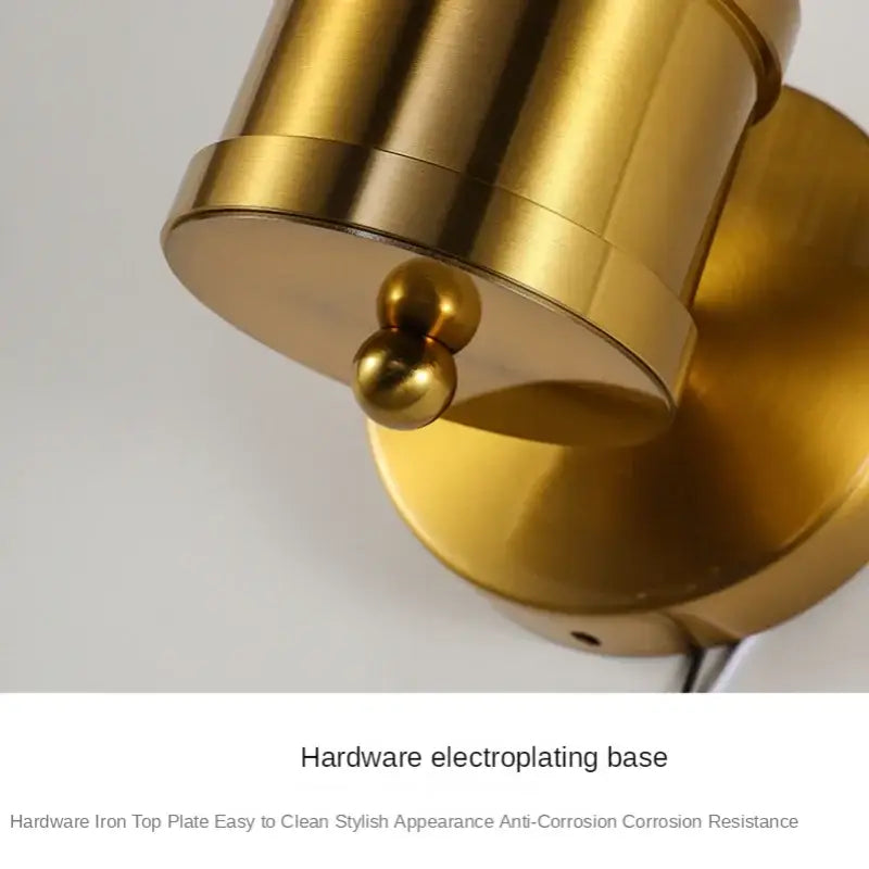 Modern gold decorbites crystal led wall lights featuring a gold cylindrical brass spotlight with spherical accent for bedrooms