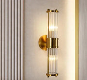 Modern gold decorbites crystal led wall lights featuring vertical clear glass rods in a sleek bedroom sconce design