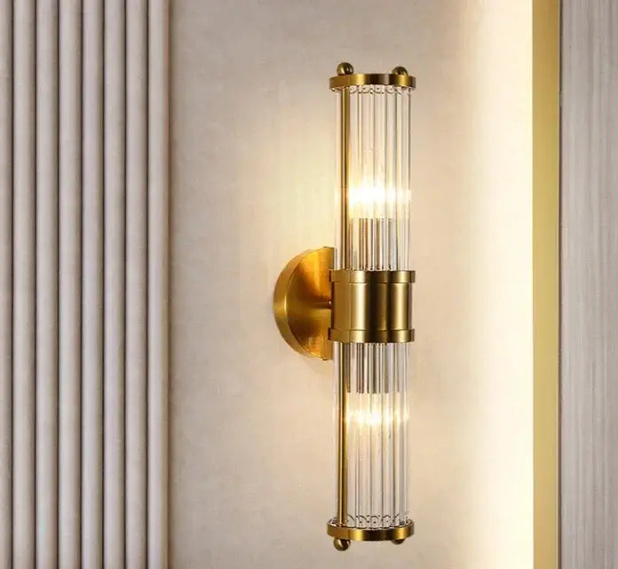 Modern gold decorbites crystal led wall lights featuring vertical clear glass rods in a sleek bedroom sconce design