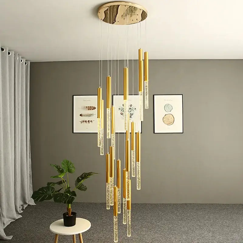 Modern gold decorbites crystal staircase chandelier with cylindrical glass rods and circular wooden ceiling mount for living room