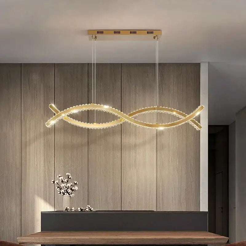 Modern gold decorbites crystal strip chandelier with a sleek double-loop design and sparkling crystal accents for dining room