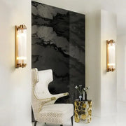 Modern gold decorbites crystal wall sconce with gold finish and vertical frosted glass panels for bedroom lighting