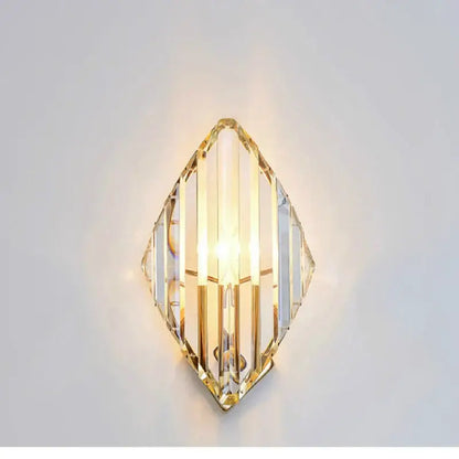 Modern gold decorbites crystal wall sconce with clear faceted crystal panels and gold-toned metal framing for living room