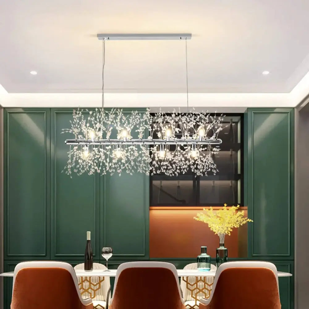 Modern gold decorbites dandelion led chandelier with sleek silver frame and cascading crystal branches emitting warm light