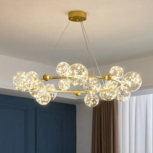 Modern gold decorbites glass ball chandelier with clear glass spheres and warm led lights for dining room lighting