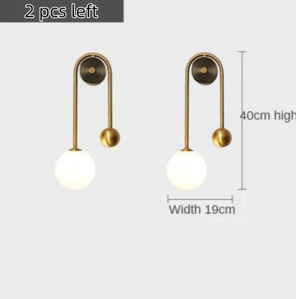 Modern gold decorbites glass ball led wall lamp with curved arm and frosted glass shade for bedroom use