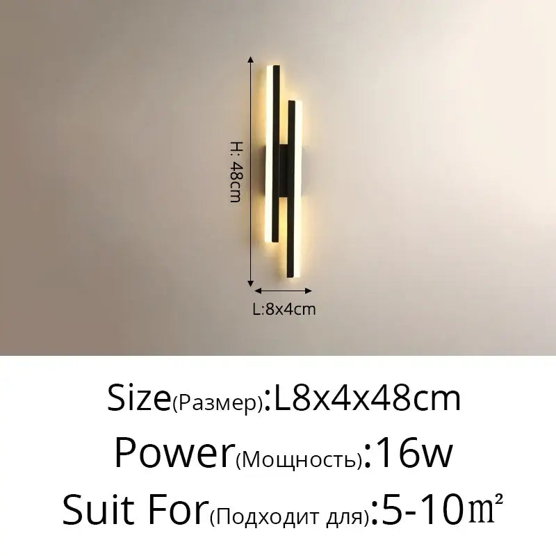 Modern black wall sconce with two vertical bars and a glowing light strip.