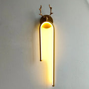 Modern gold deer head wall lamp with arched led sconce emitting warm yellow light for bedroom decorbites deer head decor