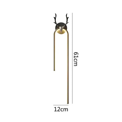 A sleek modern wall lamp with black decorbites deer head and gold metal arms for bedroom deer head wall decor