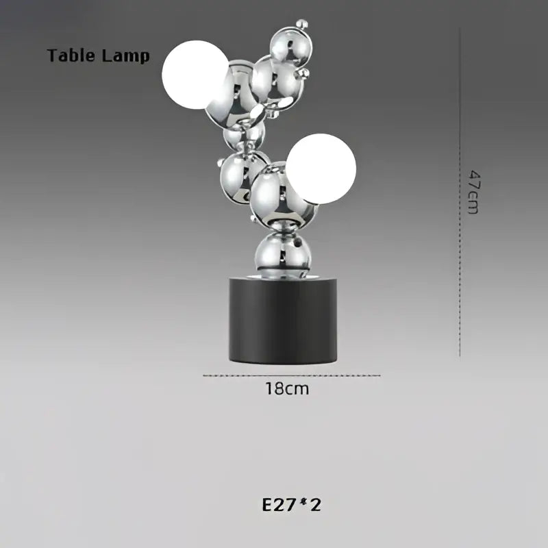 Silver metallic table lamp with black base featuring spherical bulbs in decorbites designer molecule chandelier style