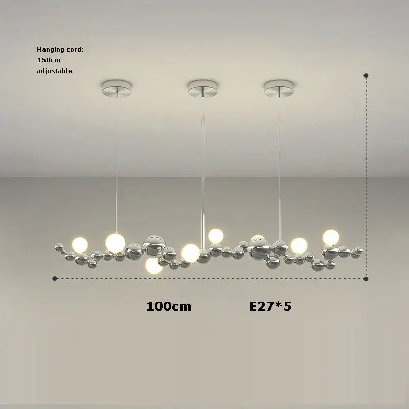 Modern chrome finished pendant chandelier with five spherical bulbs in a decorbites designer molecule dining room light