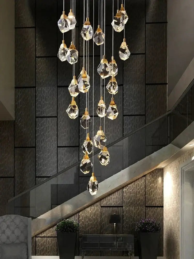 Modern gold diamond crystal ball chandelier with faceted clear glass pendants and gold-toned metal fixtures for dining room