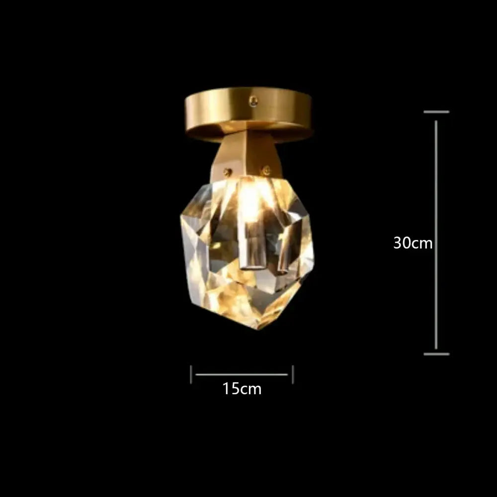 Modern gold diamond crystal brass led pendant light featuring a faceted crystal design with a brass mounting base