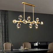 Modern gold diamond crystal brass led pendant light featuring faceted crystal droplets on a rectangular frame