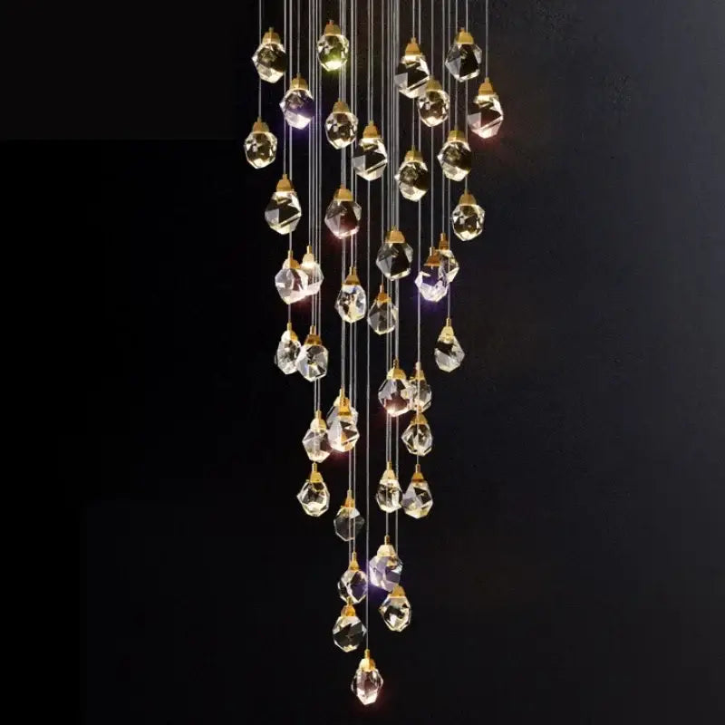 Modern gold diamond crystal chandelier with faceted crystal droplets creating a sparkling effect for living room staircase