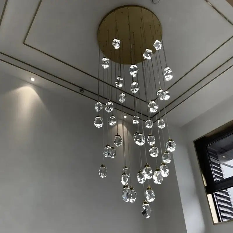 A modern gold diamond crystal chandelier with faceted clear crystals for living room staircase lighting