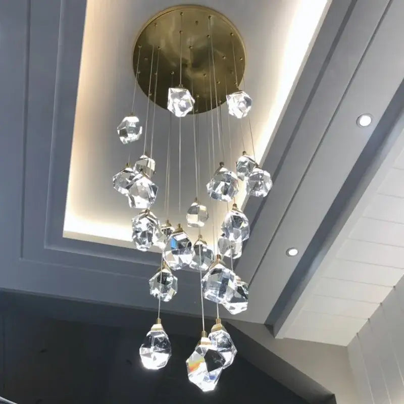 Modern gold diamond crystal chandelier with faceted clear glass pendant lights on brass ceiling mount for living room