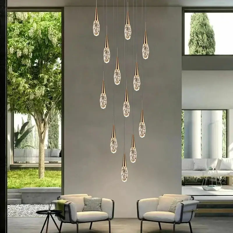 A modern gold diamond crystal chandelier with teardrop-shaped pendants suspended by thin rods for living rooms