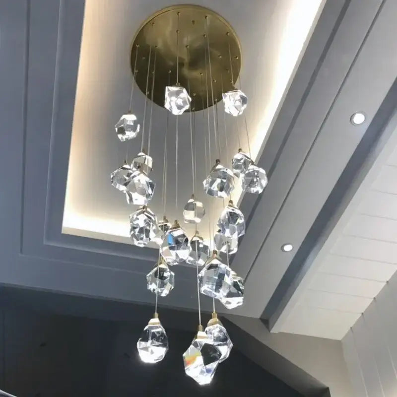 A modern gold diamond crystal chandelier with faceted glass pendants for staircase led lighting