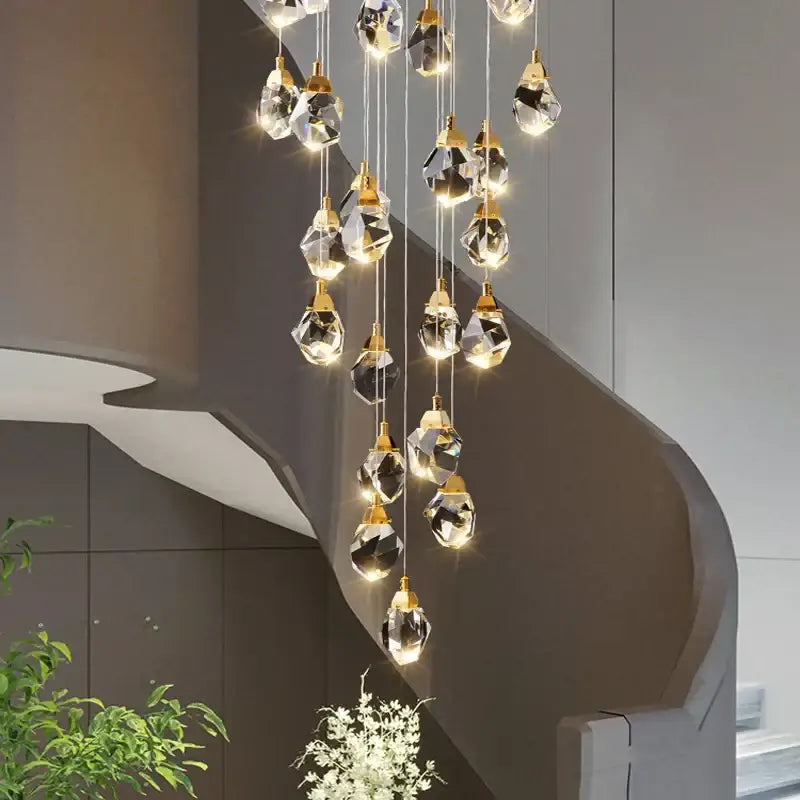 A modern gold diamond crystal led ceiling chandelier with faceted glass pendants for dining room use