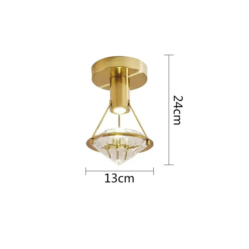 Modern gold diamond crystal wall lamp with clear faceted crystal shade for elegant bedroom lighting