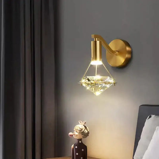 Modern gold diamond crystal wall lamp featuring a gold-finished wall sconce with a diamond-shaped crystal pendant