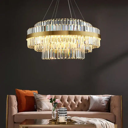 Modern gold dimmable led pendant light with decorbites gold metal and cascading crystal prisms for dining room decor