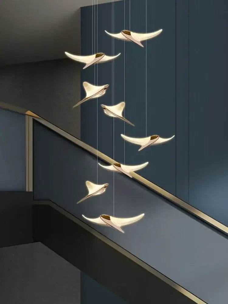 Modern white and gold stingray-shaped dolphin pendant chandelier by decorbites for hotel lobby staircase lighting decor