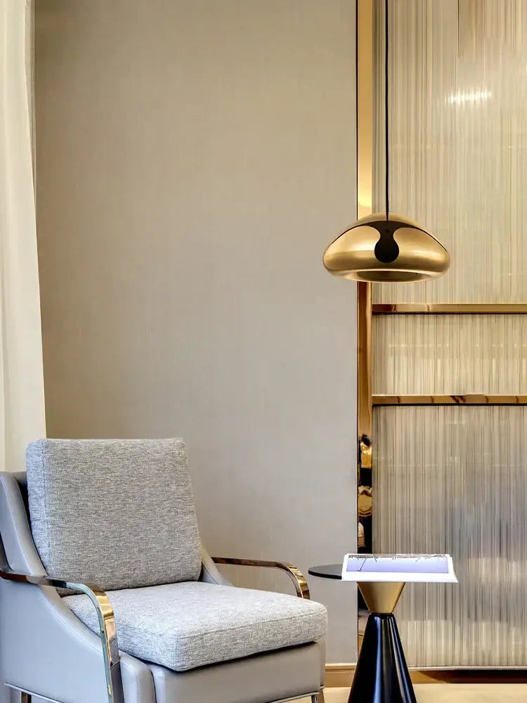 A sleek gold-toned dome pendant lamp with black accent for dining room decorbites glass gold ceiling lighting