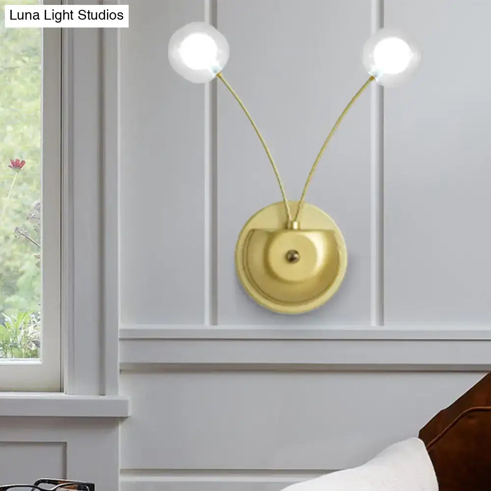 Modern gold double arm wall lamp with curved arms and spherical glass bulbs 12 inch fixture for bedroom lighting