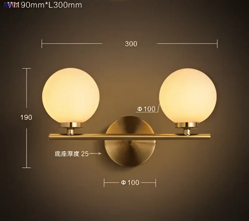 Modern gold brass-finished led wall lights with two frosted glass ball globes for bedroom lighting