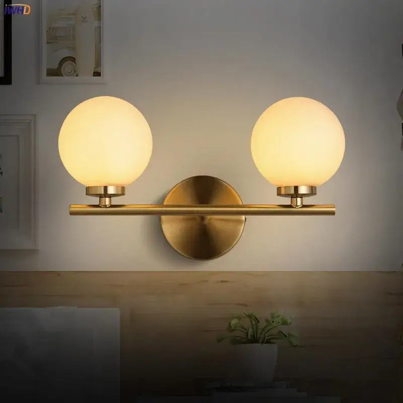 Modern gold dual glass ball led wall lights featuring two spherical frosted shades for bedroom lighting