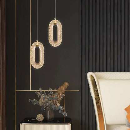 Modern gold duplex crystal chandelier featuring oval pendant lights with intricate crystal detailing for villa living room