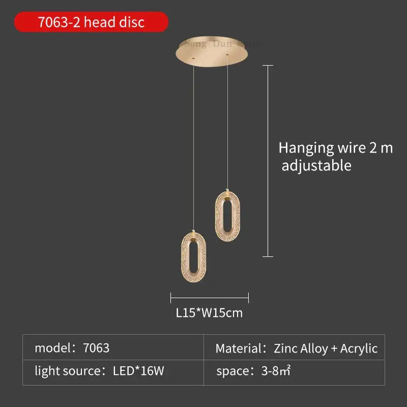Modern gold duplex crystal chandelier with gold-toned oval textured pendant lights hanging from adjustable wire