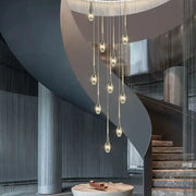 Modern gold elegant crystal chandelier with slender metal arms and clear teardrop bulbs for living room decorbites elegant crystal