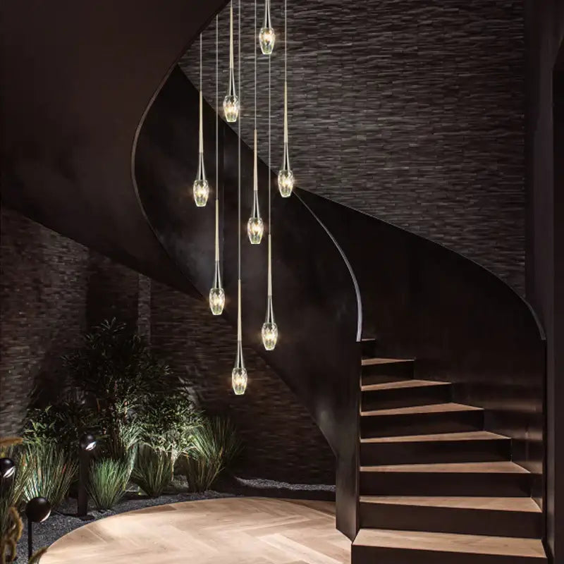 Modern gold elegant crystal chandelier with gold-toned pendant lights and clear glass shades by decorbites elegant crystal