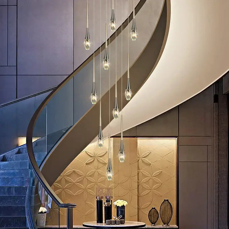 Modern gold elegant crystal chandelier with silver-toned teardrop pendant lights by decorbites elegant crystal decor