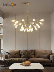Modern gold elegant firefly chandelier with multiple exposed bulbs in a branching design for dining room decorbites elegant firefly