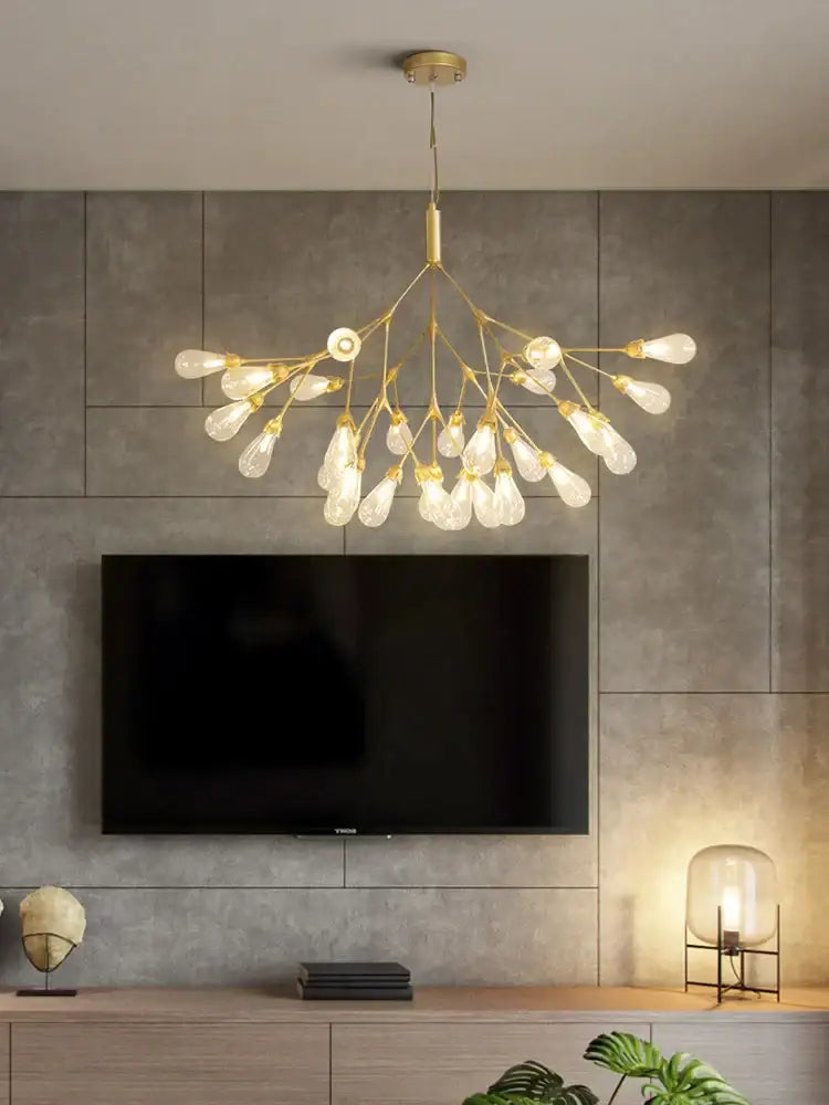 Modern gold elegant firefly chandelier with clear glass bulbs in a branching design for dining room decorbites elegant firefly