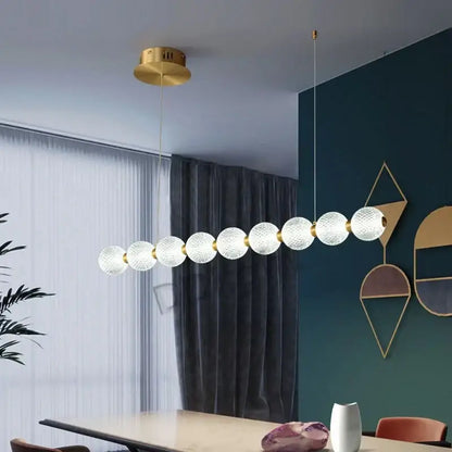 Modern gold elegant pearl necklace chandelier featuring textured frosted glass spheres and metallic joints for living room decorbites elegant pearl decor