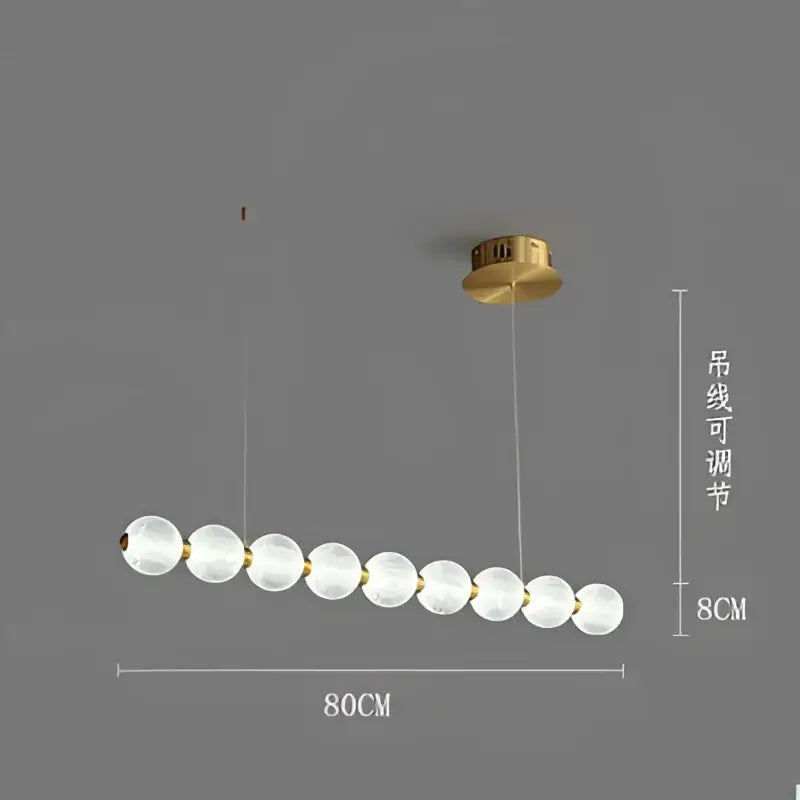 Modern gold elegant pearl necklace chandelier featuring frosted glass globes in a linear row for living room decorbites elegant pearl