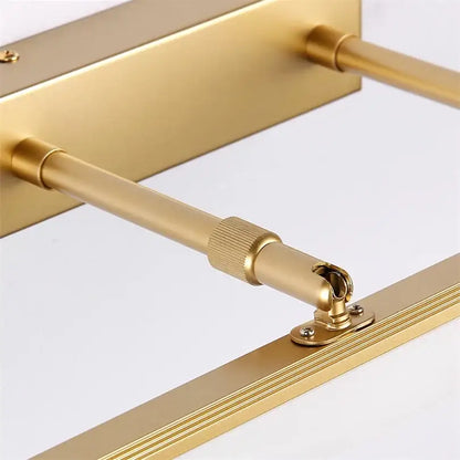 Gold-finished metal towel rack with adjustable rods and decorative grooves for decorbites elegant vanity led bathroom decor