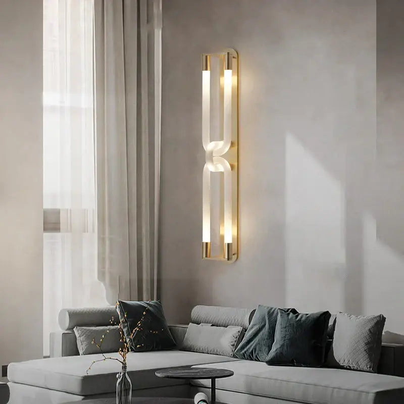 Modern gold elegant wall mounted light with two frosted glass panels emitting warm ambient glow for bedroom decorbites elegant wall decor