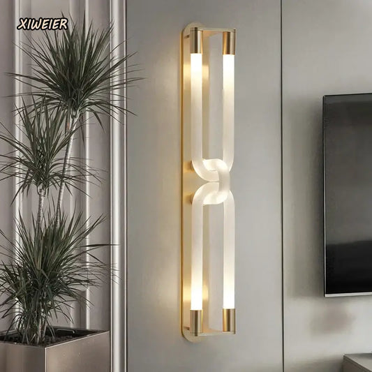 Modern gold elegant wall mounted glass sconce featuring two frosted tubes and a curved joint for stylish wall mounted light decorbites elegant wall