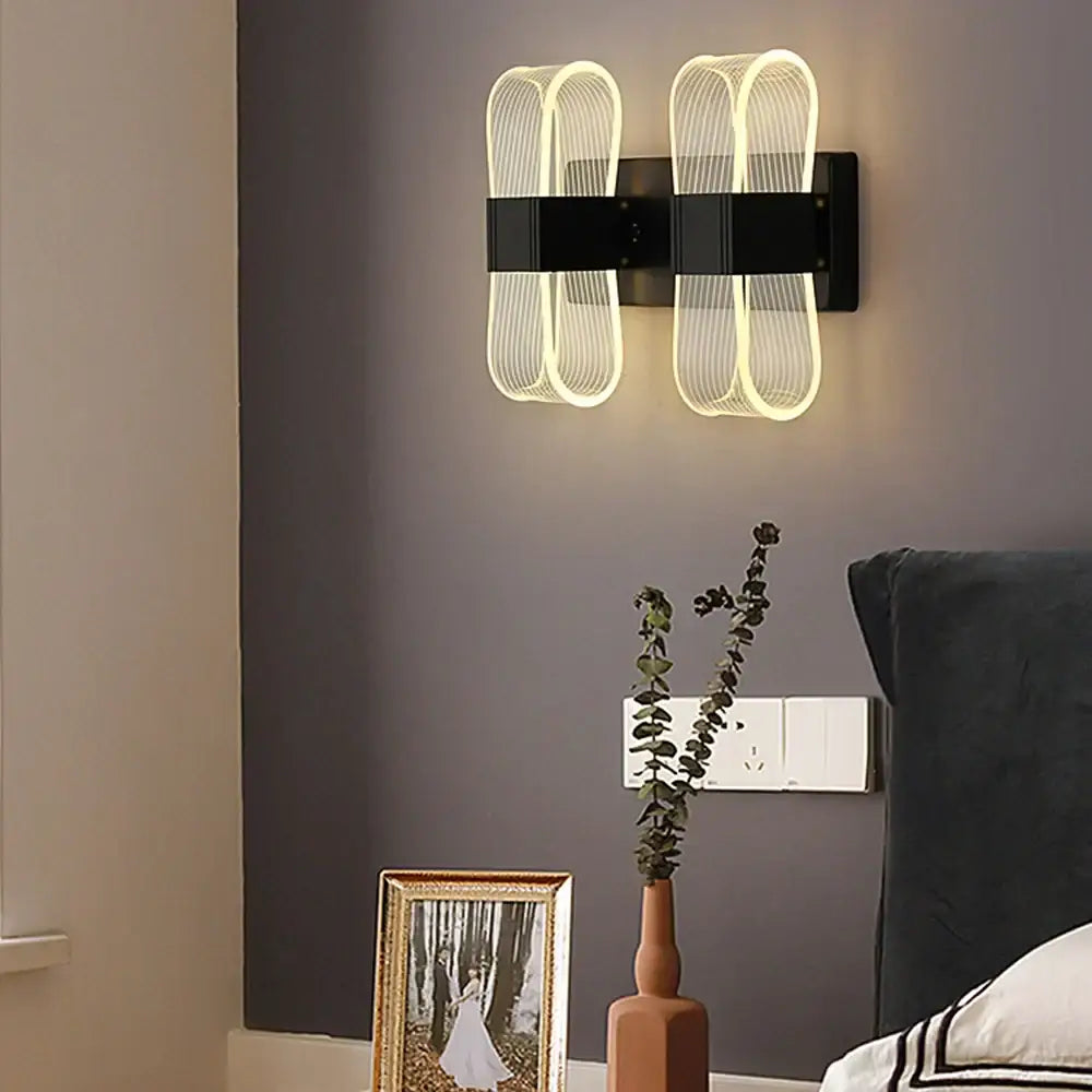 Modern black wall lamp with two illuminated curved wireframe sections for bedroom decorbites elliptical led wall use