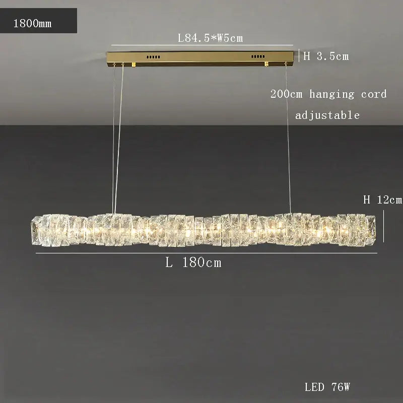 Modern gold elongated glass chandelier led ceiling light with crystal-like segments emitting warm light for dining room