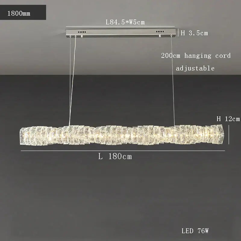 Modern gold elongated glass chandelier led ceiling light with stacked crystal segments emitting warm light for dining room