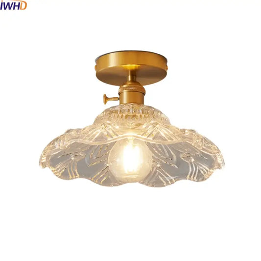 Modern gold-toned led ceiling lamp with intricately etched clear glass shade featuring leaf-like patterns for living room